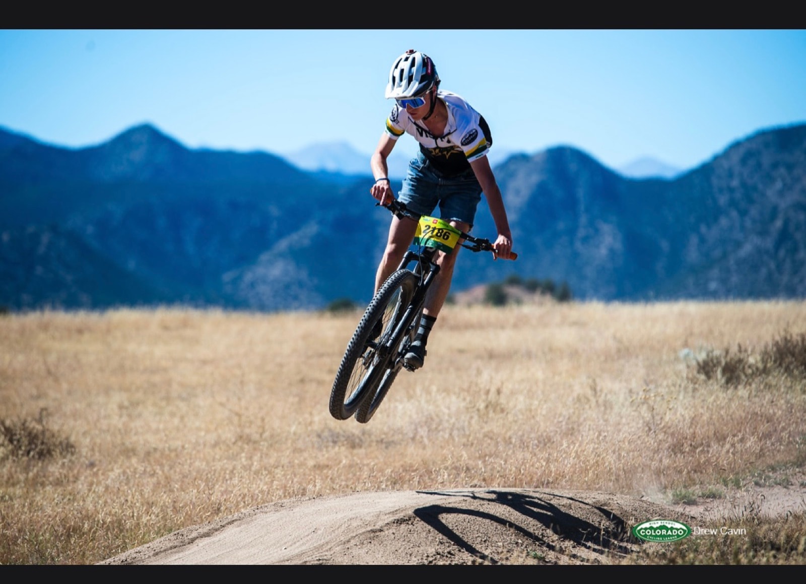 A Colorado High School Cycling League racer jumping a rise on the Royal Gorge Ranch & Resort race course